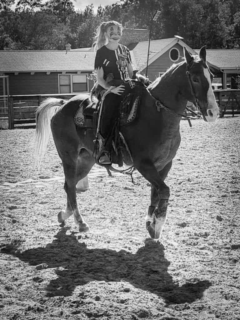 Black and white photo of a Four Cain's rider with her horse